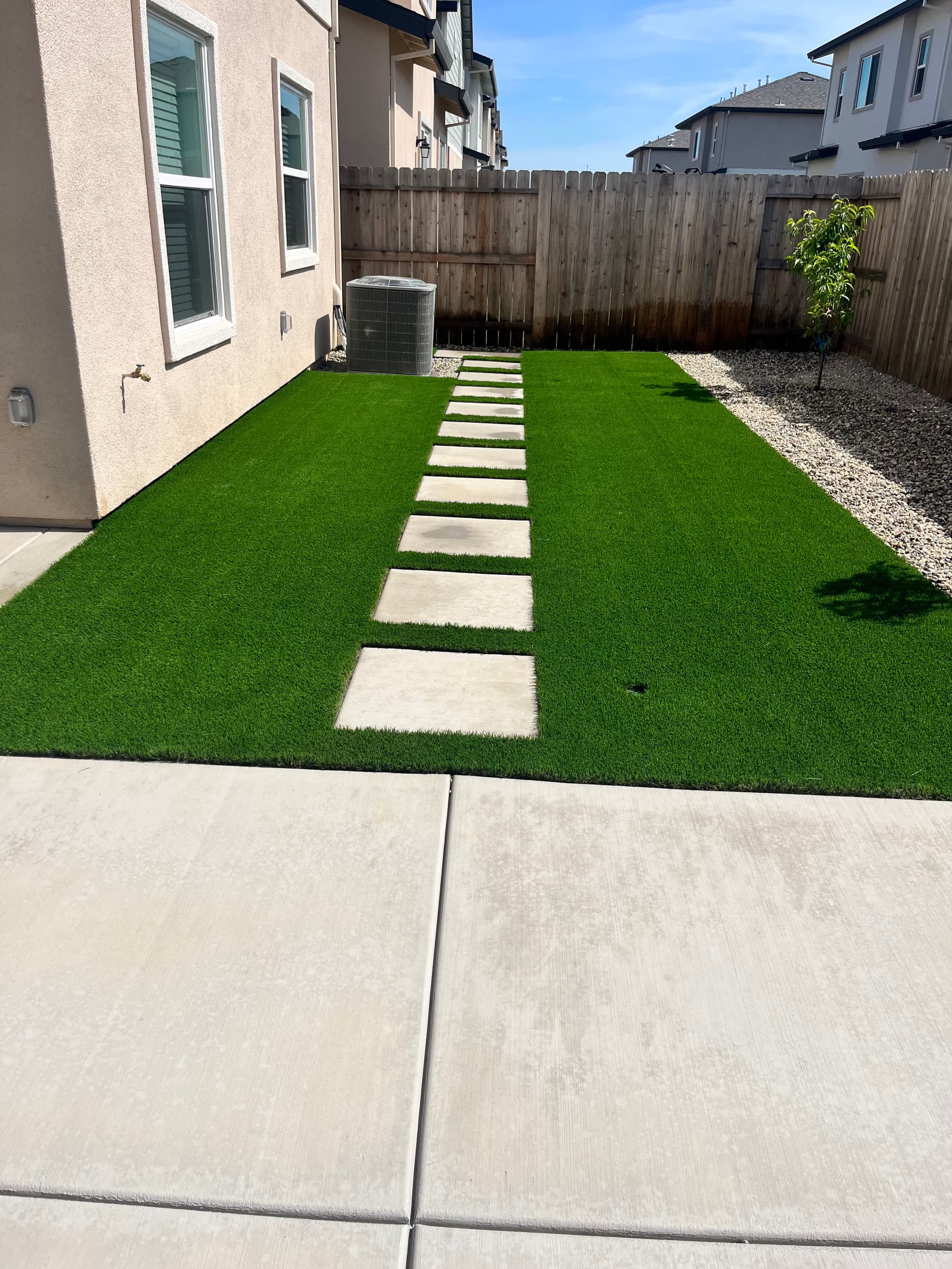 Gallery photos for New Build Backyard Gets Artificial Turf Concrete and Fruit Trees: Image #1